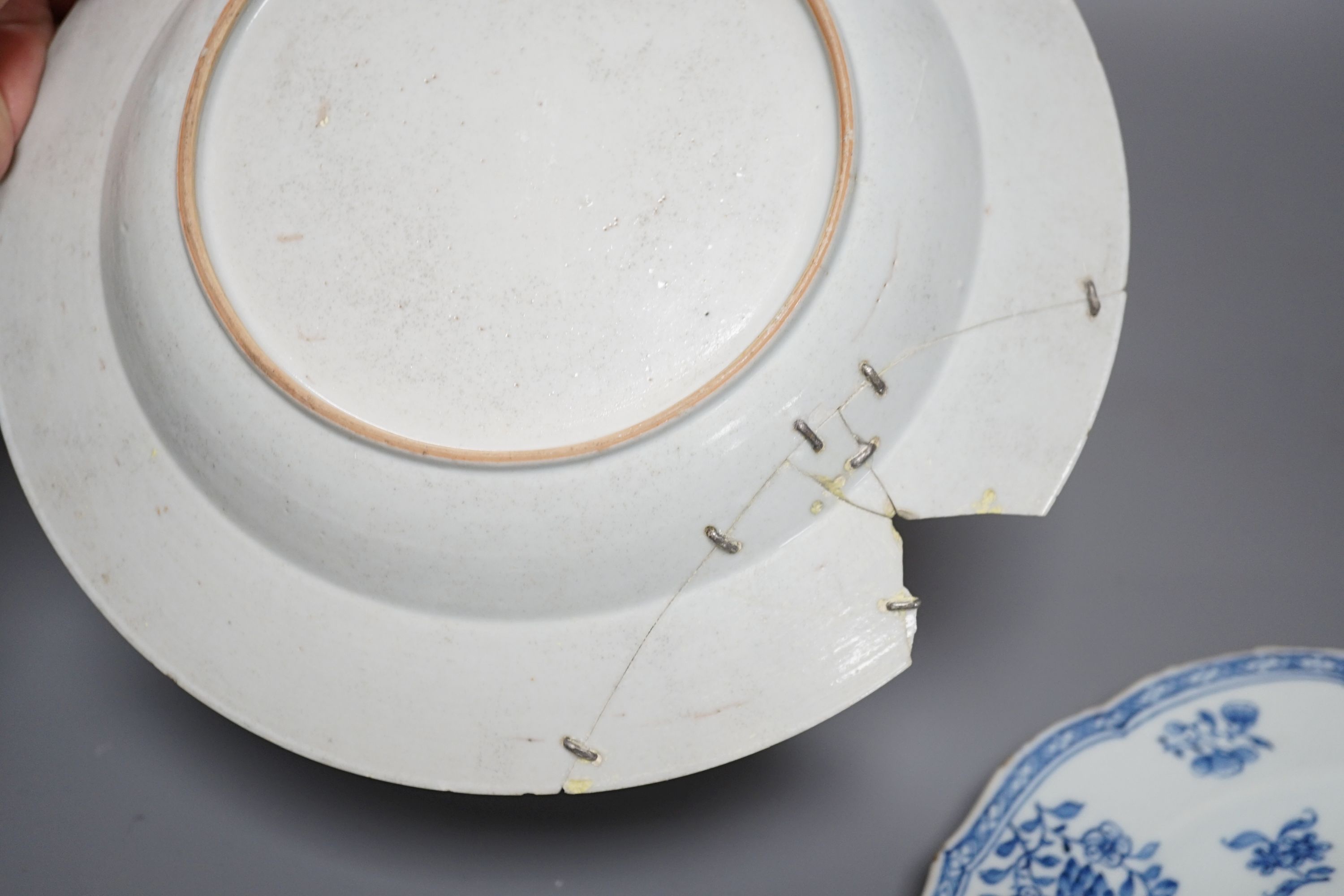 An 18th century Chinese export blue and white dish, 23cm, together with three other Chinese ceramic items